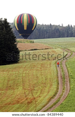 SUSSEX, CANADA - SEPTEMBER 9: Wind Spirit (Joel Jones - Seale, Alabama) lands in a field at the Atlantic International Balloon Fiesta on September 9, 2011 in Sussex, Canada.
