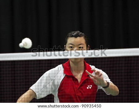 MONCTON, CANADA - DECEMBER 15: Grace Gao of Canada follows her serve at the Yonex Moncton International Challenge badminton event on December 15, 2011 in Moncton, Canada.