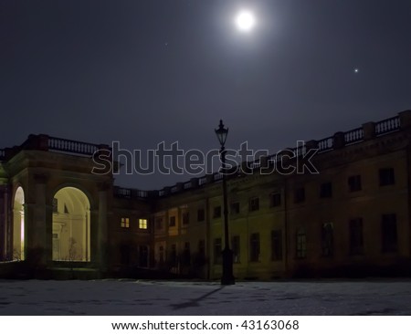 Old lantern at night . Blue moon under dark Alexandrian palace. Saint-Petersburg, Russia