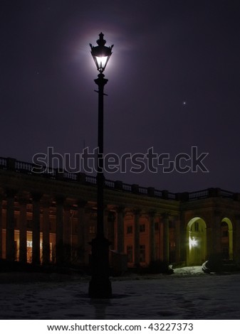 Old streetlight at night . Blue moon dark palace