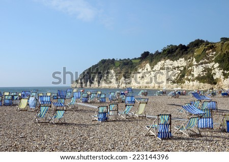 Deckchairs on beach at Beer in South Devon