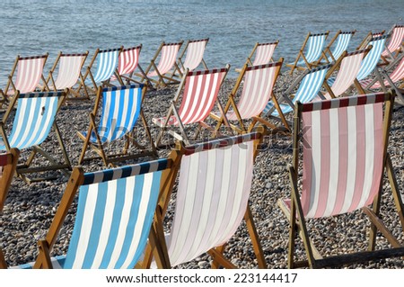 Deckchairs on beach at Beer in South Devon