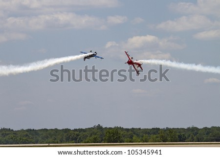 ROCKFORD, IL - JUNE 3: Firebirds airplane team demonstrates flying skills and aerobatics at the annual Rockford Airfest on June 3, 2012 in Rockford, IL