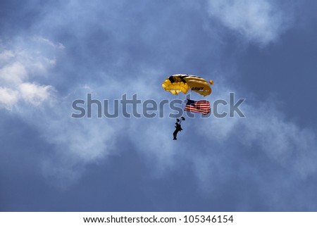 ROCKFORD, IL - JUNE 3: U.S. Army Golden Knights Parachute Team demonstrates flying skills at the annual Rockford Airfest on June 3, 2012 in Rockford, IL