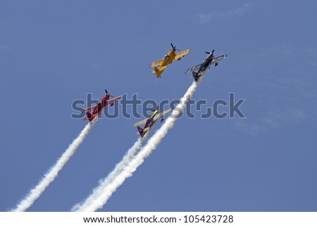 ROCKFORD, IL - JUNE 3: Airplane formation demonstrates flying skills and aerobatics at the annual Rockford Airfest on June 3, 2012 in Rockford, IL