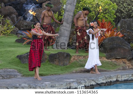 KAUAI, HAWAII - AUGUST 7: Aloha festival. Attractive young people in traditional dress perform Hawaiian dance on August 7, 2012 in Lihue, Kauai.