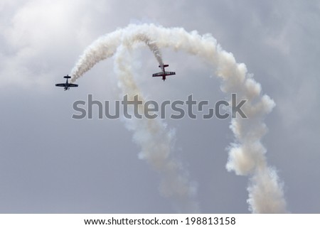 ROCKFORD, IL - JUNE 7: Airplanes from Team Firebirds demonstrates flying skills and aerobatics at the annual Rockford Airfest on June 7, 2014 in Rockford, IL