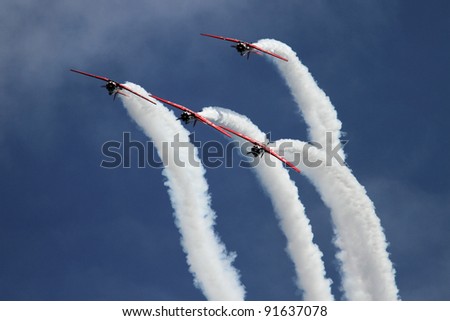 CHICAGO, IL - AUGUST 14: Airplane formation demonstrates flying skills and aerobatics at the annual Chicago Air and Water show on August 14, 2010 in Chicago, IL