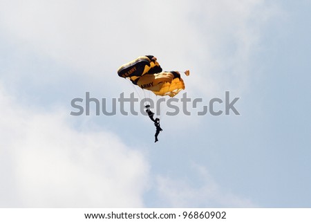 ROCKFORD, IL - JULY 31: U.S. Army Golden Knights Parachute Team demonstrates flying skills at the annual Rockford Airfest on July 31, 2010 in Rockford, IL