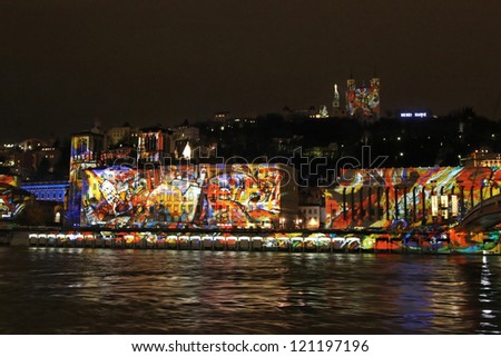 LYON, FRANCE - DECEMBER 7 : Festival of Lights in the city streets on December 7, 2012 in Lyon, France. Festival of Lights expresses gratitude toward Mary, mother of Jesus around December 8 each year