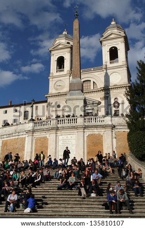 ROME, ITALY - APRIL 3 :  Young people use to meet on the stairway of Trinita dei Montei, in Rome, Italy, on April 3, 2013. Piazza di Spagna is one of the most famous place in Rome.
