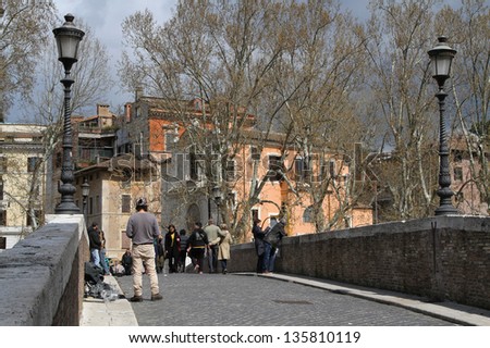 ROME, ITALY - APRIL 4 : First sun in April on the bridges over Tiber, in Rome, Italy, on April 4, 2013. Rome is one of the most visited place in Europe.