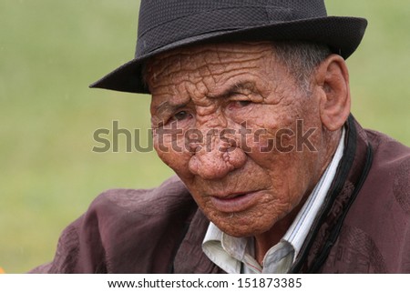 KHARKHORIN, MONGOLIA, JULY, 8 - Old man in traditional clothes during Naadam festival, on July 8, 2013 in Kharkhorin, Mongolia. Naadam is inscribed on the List of the Cultural Heritage of Humanity.