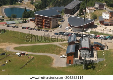 CHAMROUSSE, FRANCE, JULY 17, 2014 : Chamrousse cable car start station, and the village called \