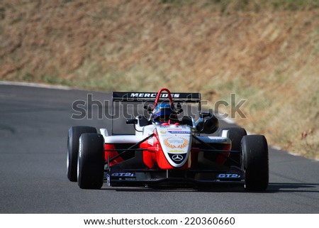 LIMONEST, FRANCE, SEPTEMBER 27, 2014 : One seated racing car rejoins the track of uphill race in Mont-Verdun, last stage of Coupe de France.