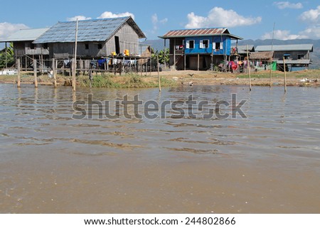 INLE LAKE, MYANMAR, December 13, 2014 :Houses on the Lake. People built on the water its houses on piles and lives on culture of fruits, vegetables and flowers on incredible floating islands