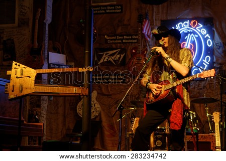 CLARKSDALE, MISSISSIPPI, May 9, 2015 : Multi-guitarist bluesman Justin Johnson plays his cigar-box guitar at Ground Zero Blues Club in Clarksdale, during The Caravan Clarksdale Blues Festival 2015.