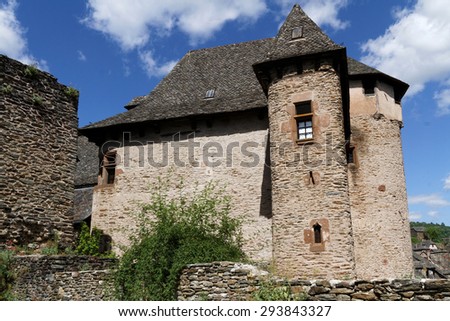CONQUES, FRANCE, June 19, 2015 : Conques has classic narrow Medieval streets. Historic core of the town has very little recent constructions, leaving the medieval structures remarkably intact.