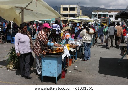 SAQISILI, ECUADOR - AUGUST 5 : At the biggest indian market of South America indian women are selling food, August 5, 2010 in Saqisili, Ecuador