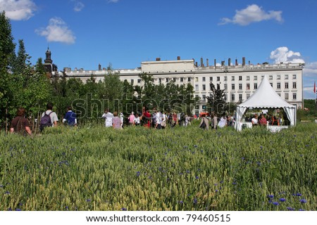 LYON, FRANCE - JUNE 18 - Inhabitants of Lyon visit the Place Bellecour and its temporary gardens during the Nature Capitale Lyon event, in Lyon, France on June, 18, 2011