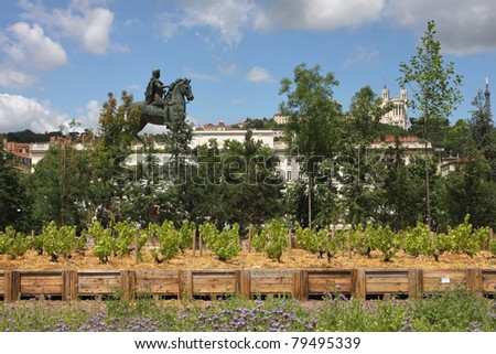 LYON, FRANCE-JUNE 19: Inhabitants of Lyon visit the Place Bellecour and its temporary gardens during the Nature Capitale Lyon event, in Lyon, France on June, 19, 2011