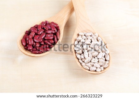 beans and rice in a wooden spoons