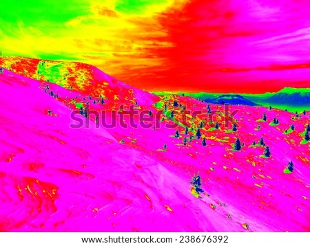 Infrared photo of Alpine winter hilly landscape. Sunny weather with clear sky above. Amazing thermography colors.