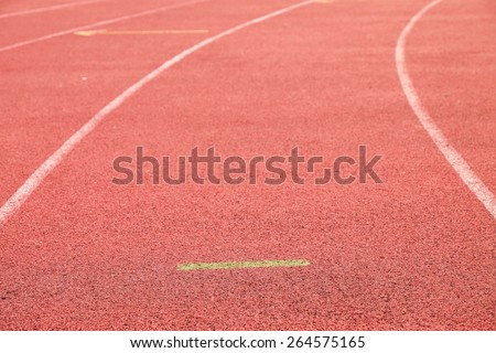 White lines and texture of running racetrack, red rubber racetracks in outdoor stadium