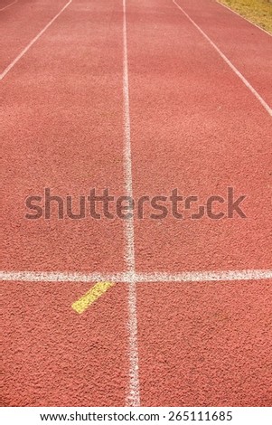 White and yellow lines and texture of running racetrack, red rubber racetracks in outdoor stadium