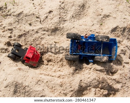 Plastic toy truck on the sands, accident in the salt sand of the coast