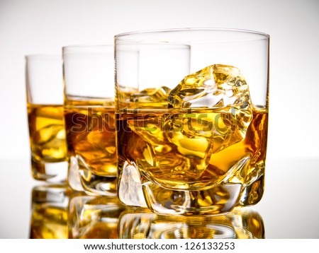 stock-photo-three-glasses-of-whiskey-on-the-rocks-