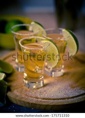 Tequila shots with wedges of lime and salt