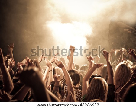Crowd at a concert, hands up. High ISO!