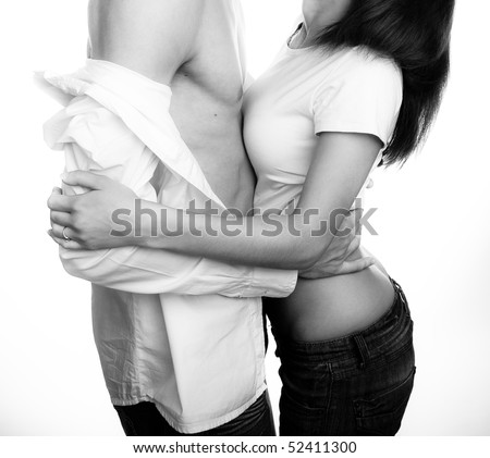 stock photo Young couple undressing each other