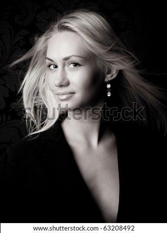 Head and shoulders portrait of a blond beauty model with long hair