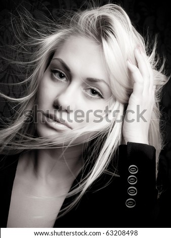 Head and shoulders portrait of a blond beauty model with long hair