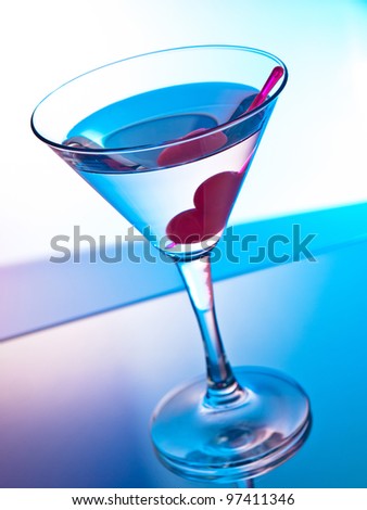 Glass of martini cocktail with cherries