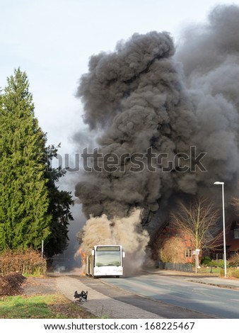 BALGE, GERMANY - DECEMBER 16, 2013: A bus burns at a bus stop on December 16, 2013 in Sebbenhausen, community Balge, Germany.