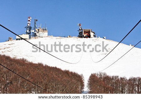 Snow on the mountains in Italy covering a radio station