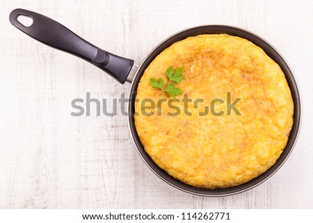 Fresh homemade Spanish tortilla (omelette) in the frying pan