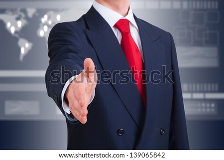 young businessman offering to shake hands against an high-tech interface. Clipping path included