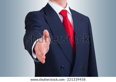 young business man offering to shake hands. Clipping path included