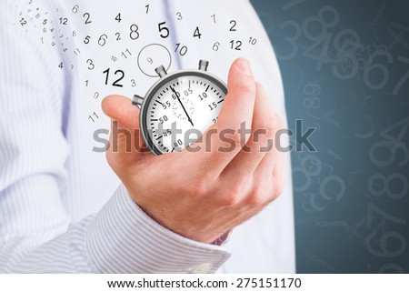 Hand Holding Stopwatch with floating numbers coming out of it