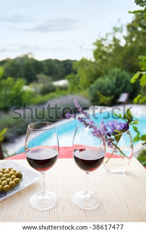 Wine glasses at the pool. Relaxing scene