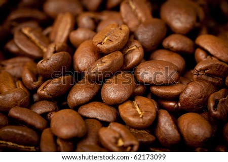 Coffee beans pile background, close up
