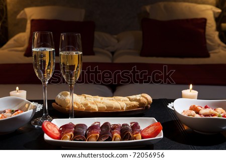 romantic dinner with champagne in the bedroom. Low key