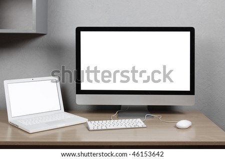 Desktop and notebook computer on a desk