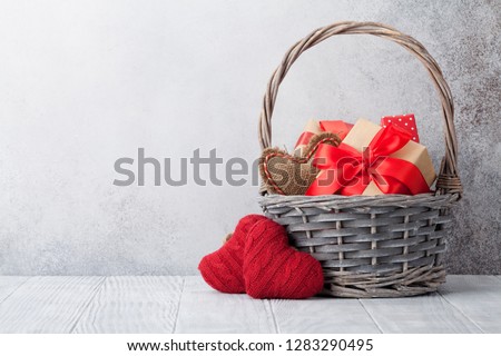 Valentine\'s day greeting card with gift boxes in basket. With space for your greetings