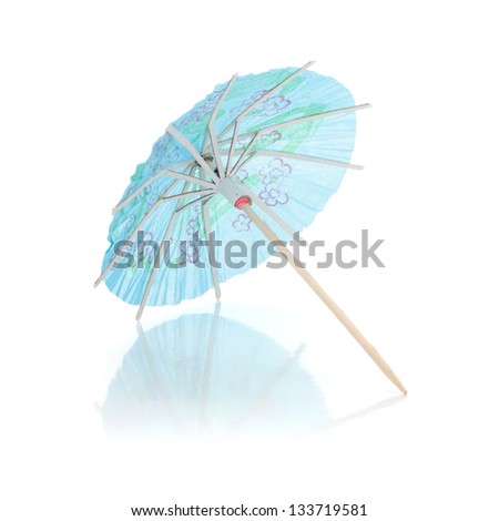 Blue cocktail umbrella. Isolated on white background