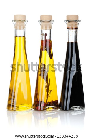 Olive oil and vinegar bottles Isolated on white background Olive oil and vinegar bottles Isolated on white background
